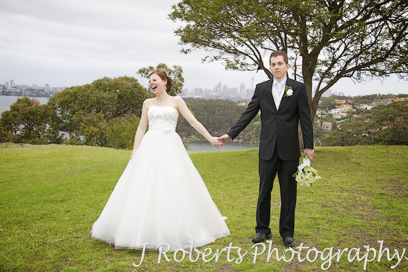 Bride and groom holding hands Georges Headland Mosman - wedding photography sydney